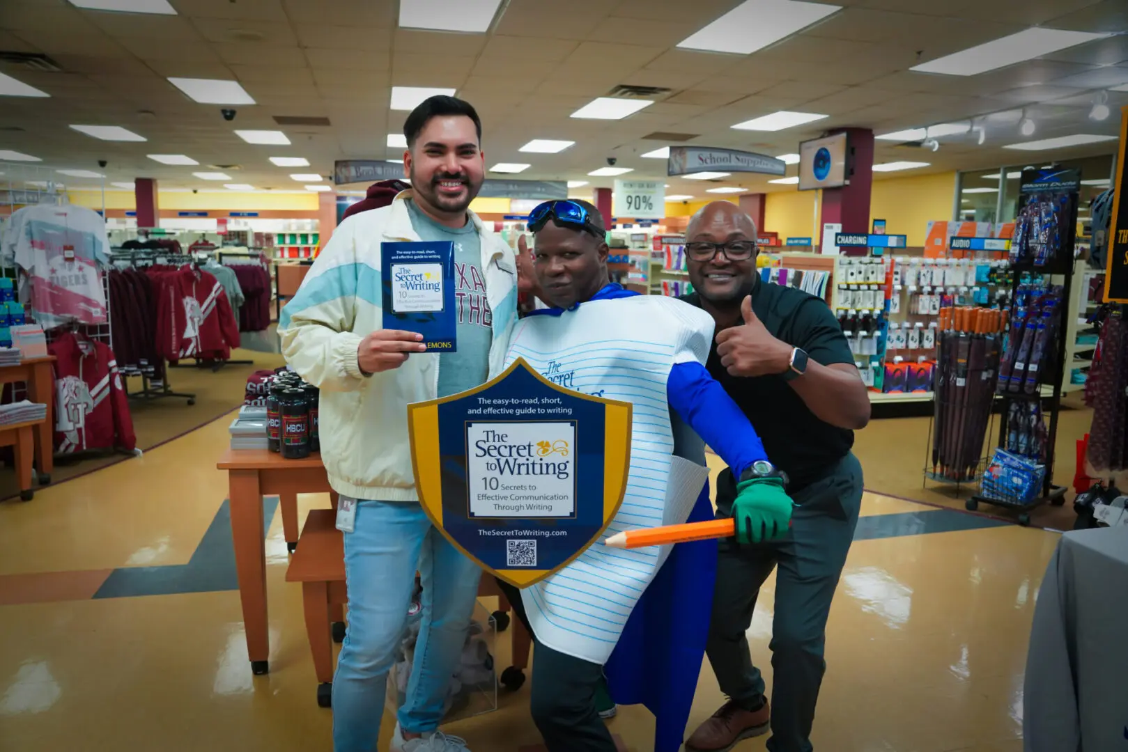 Three men posing with a plaque in the middle of a store.